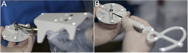 Source Figure 3, panels A–B: hands calibrating the instrument and tracked probe with a disc-shaped calibrator.
